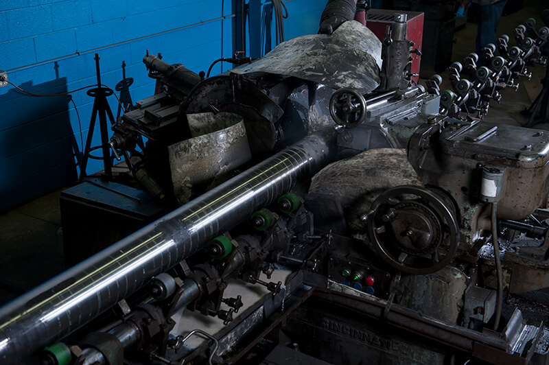 Piece of steel receiving Bar Stock Grinding 